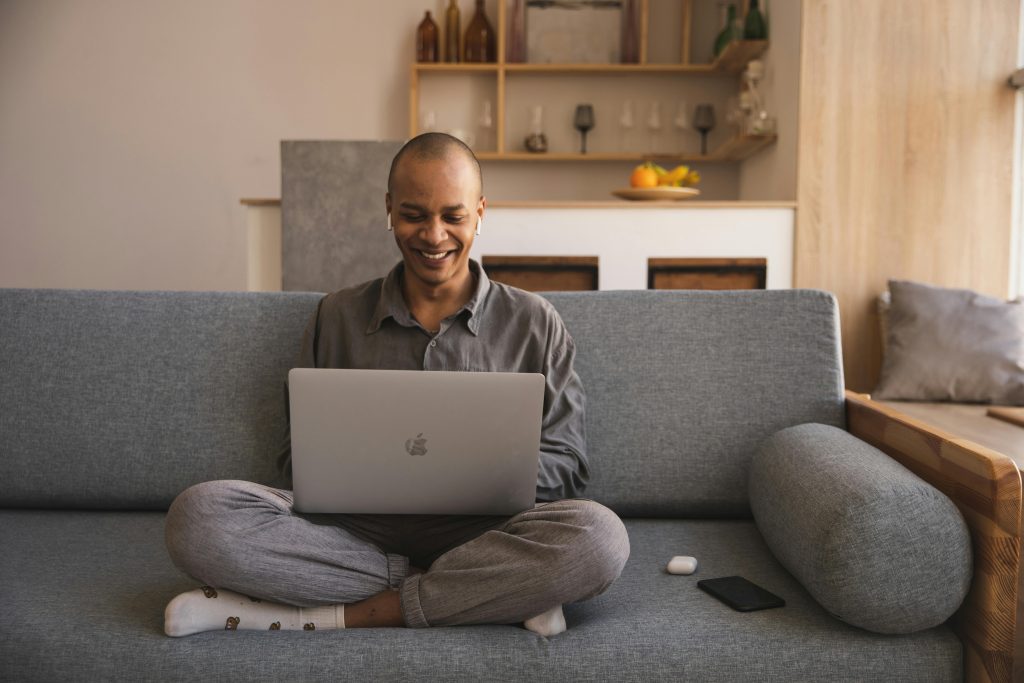 Smiling person checking their phone after same-day loan approval with DashLoans